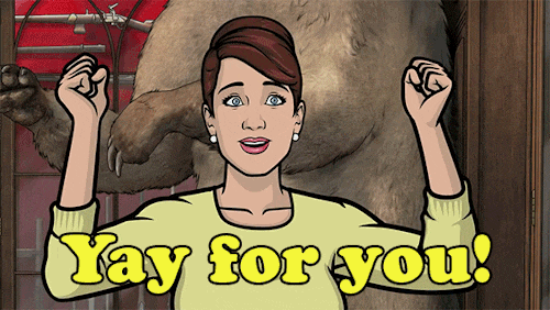 Cartoon woman (Carol from Archer) waving fists in the air. Caption: Yay for you!