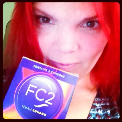 JoEllen holding a box of FC2 condoms