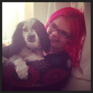 JoEllen holding a small black and white dog