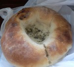 This is a bialy. Basically a bagel with a dent instead of a hole.