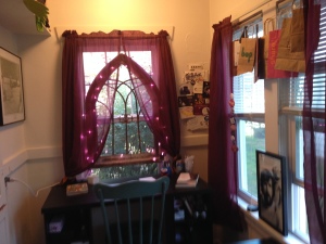 Small office with pink christmas lights