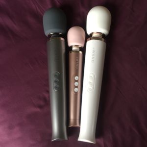 rose Gold Le Wand Petite flanked by the original Le Wand in both grey and white.
