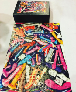 Completed puzzle- the image on the puzzle is a large pile of sex toys