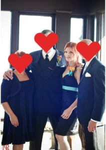 JoEllen posed with her brother, mother, and stapdad. Everyone except JoEllen has their face blocked by a heart.